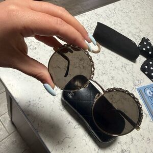 CHANEL Round Sunglasses with Black and Gold Accents